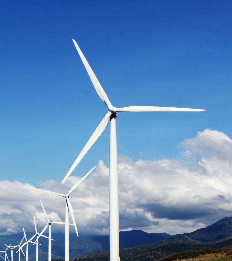 Windmill with blue sky and clouds